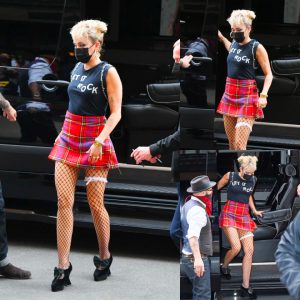 Miley Cyrus Turns Heads in Striped Mini Dress and Fishnet Garter as She Stylishly Returns to Her NYC Hotel After SNL Rehearsals